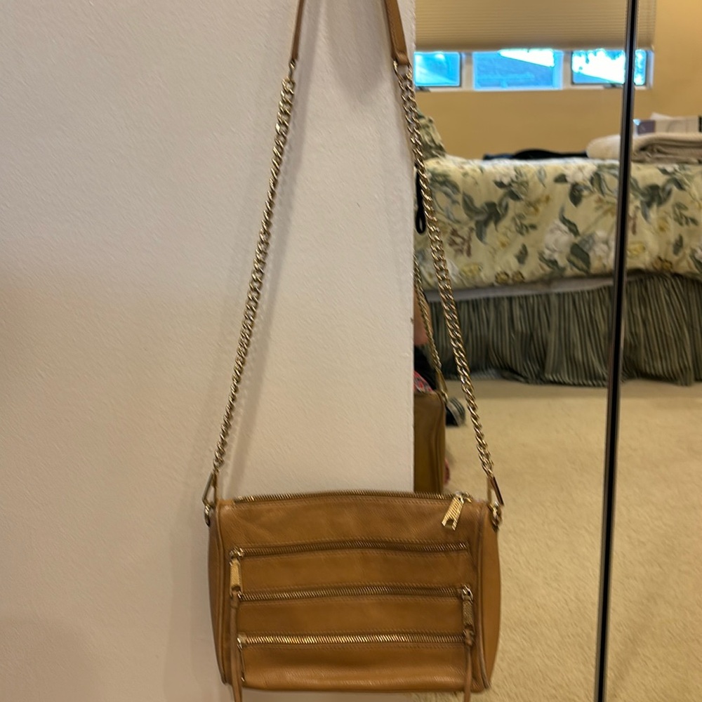 Rebecca minkoff tan cross body. Gold chain and gold detail. Used. Good condition
